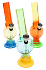 Three 6-inch multicolor acrylic bongs with suction bases and grommeted metal bowls, compact bubble style for dry herb use.