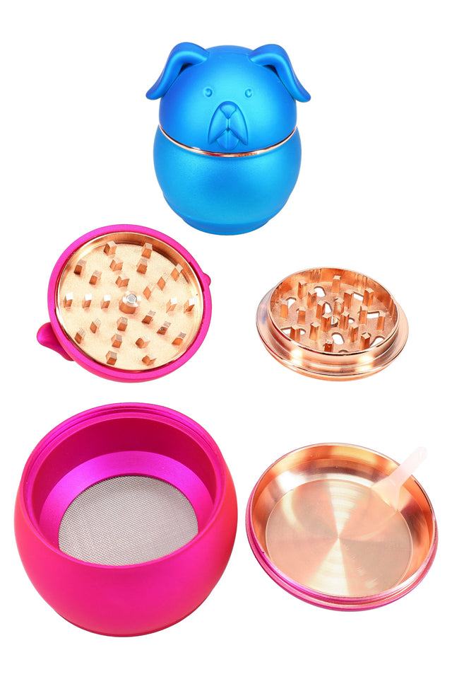 Blue pug-shaped 54 mm zinc alloy herb grinder assembled, round body with floppy ears and metallic sheen on white background.