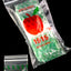 Clear mini zip baggies with bright-green dollar-sign print bundled in Apple Bags sleeve, isolated on black glass surface