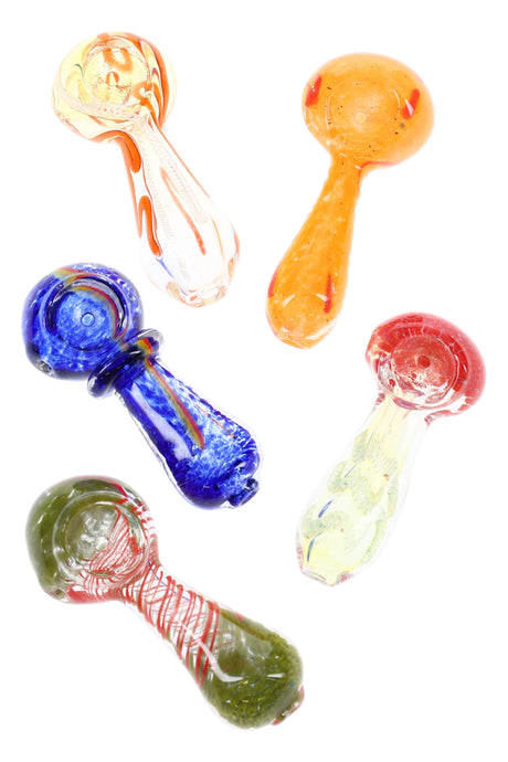 Five assorted 3-inch color-changing glass pipes with frit, swirl and stripe designs, arranged together on a white background