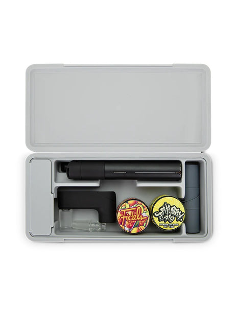 Open Puffco travel case fitted with Pivot, add-ons and jars, plus silicone cradle for accessories and swab channel.