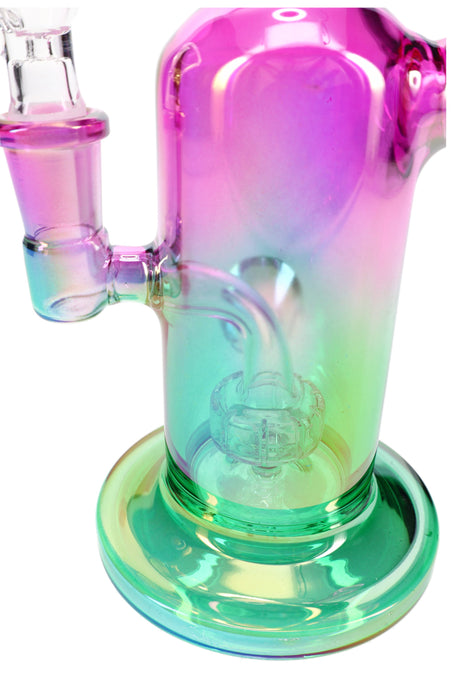 Detail view of the internal stemline showerhead percolator inside a green-pink metallic glass mini bong.