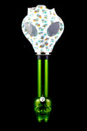 Green skull-base acrylic bong with white mask covered in tiny blue character decals and eye windows.
