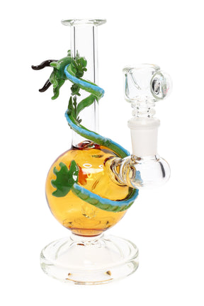Side angle Dragon Sphere glass mini rig with clear beaker base, amber globe chamber, and green dragon wrap