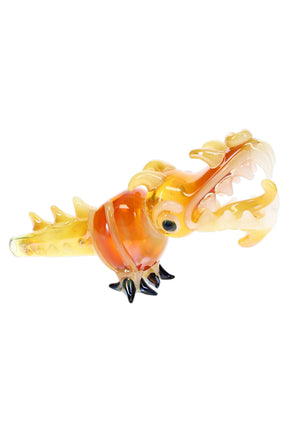 Gold fumed dragon glass pipe with open jaws, amber body, raised claws, teeth, and spiked tail