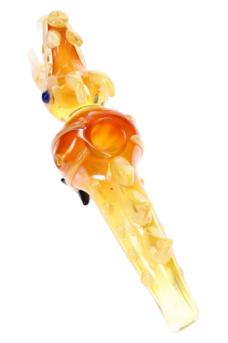 Top view of amber dragon glass pipe with open mouth, bowl, raised spikes, and fumed body details