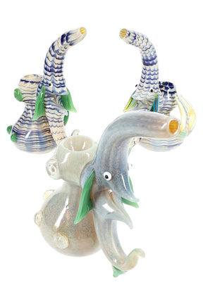 Front-angle view of 6.5-inch silver-fumed sherlock bubbler with blue ribbon neck and green glass spikes, showing color-changing glass and flat base.