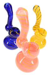 Assorted-color sherlock glass bubblers with spiral linework—blue, pink, and yellow pieces with rounded bases and carbs