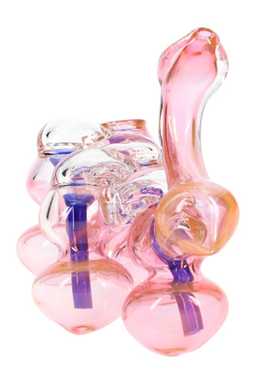 Pink gold-fumed multi-chamber sherlock bubbler with curved mouthpiece and cobalt downstems, thick glass design on a white background.