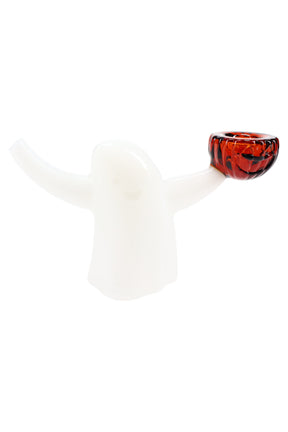 Glow-in-the-dark glass bubbler shaped like a ghost with raised arms and an orange pumpkin bowl, shown on white.