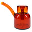 Amber 5″ NWTN Vesper glass bubbler with angled mouthpiece and wide base, shown side profile on white background.