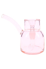 Petal pink 5″ NWTN Vesper glass bubbler with subtle tint and curved stem, minimalist mini bong design on white.