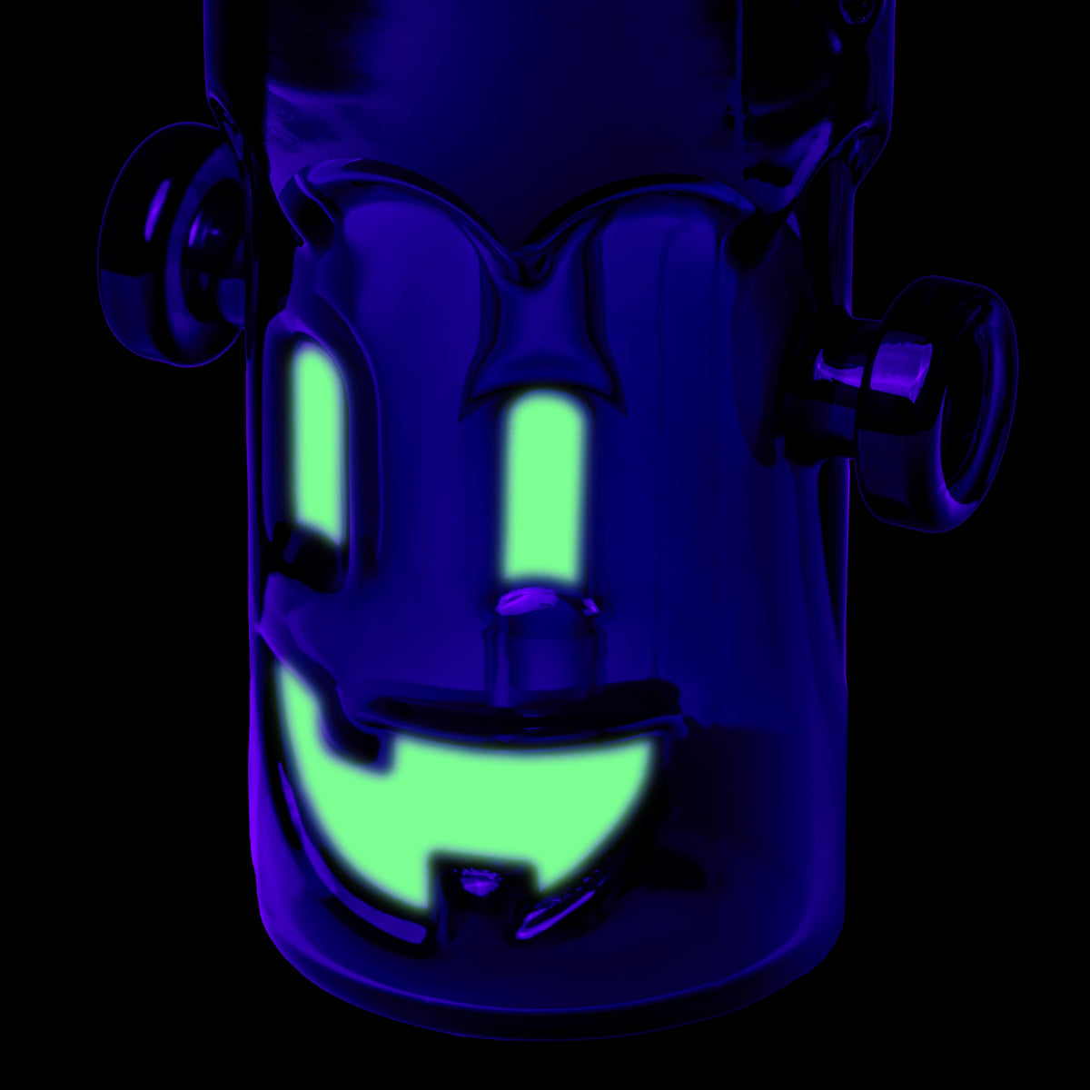 MJ Arsenal Frankenbubbler glass bubbler glowing under UV light with bright green eyes and smiling mouth