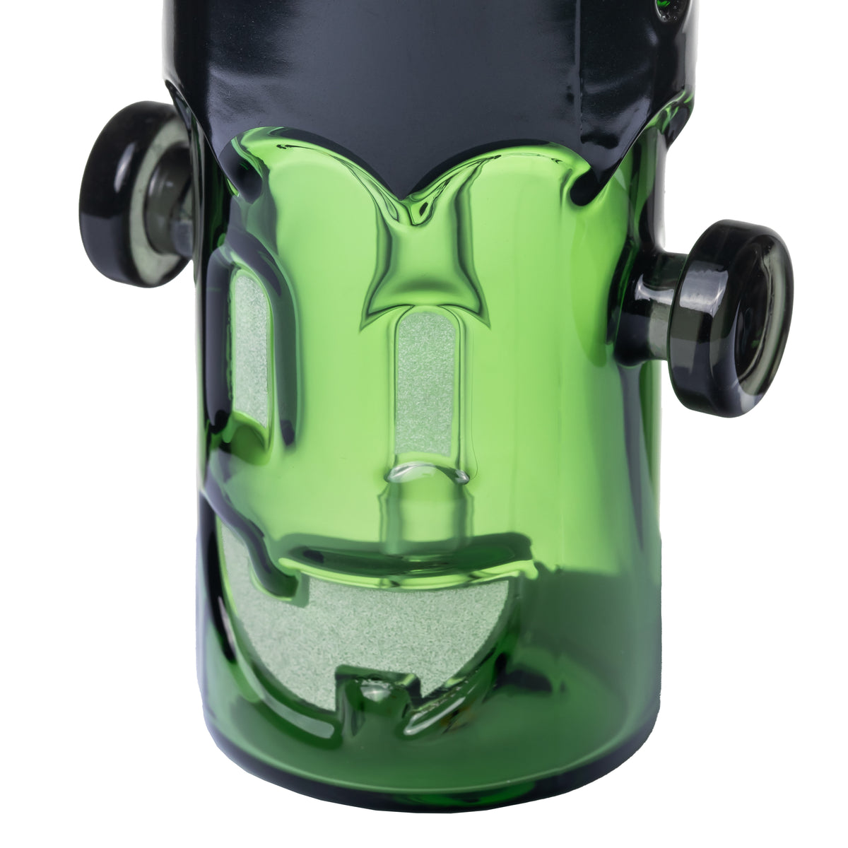 Close-up of MJ Arsenal Frankenbubbler glass bubbler showing green monster face, textured eyes and grin