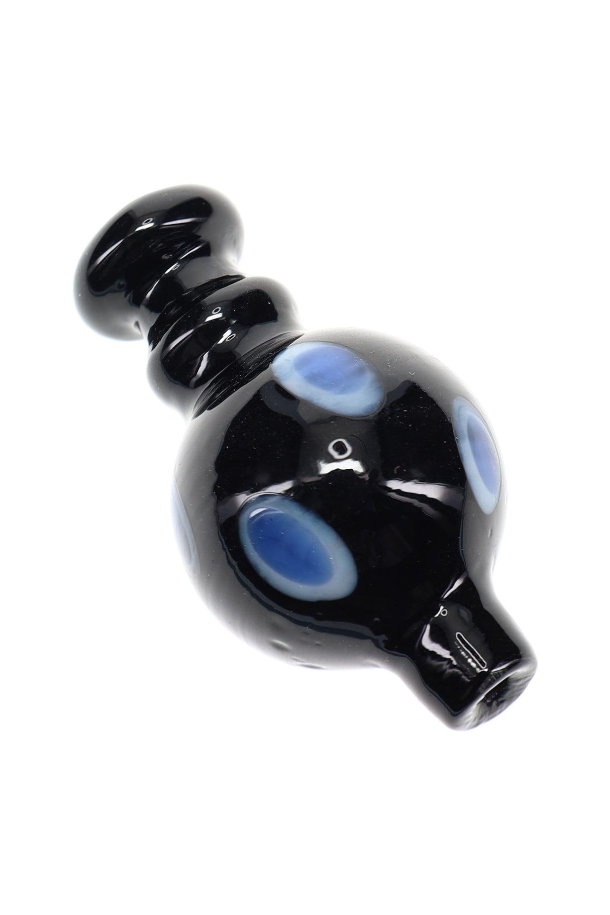 Glossy black glass bubble carb cap with blue dotted accents, rounded handle, and short spout for directing airflow on a quartz banger.