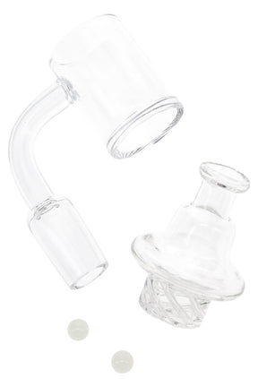 Clear quartz spinner banger set with 14.5 mm male joint, turbine cap, and two 6 mm glow-in-the-dark beads for low-temp dabs.