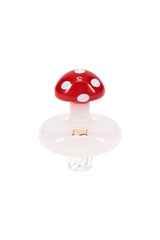 Red-and-white MJ Arsenal mushroom spinner carb cap with white disc base and clear vortex stem, borosilicate dab accessory standing upright on white background.