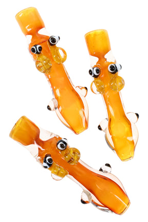 Gold-fumed 4-inch borosilicate bee chillum with clear stem, sculpted wings and eyes, and rounded bowl, shown on a white studio background.