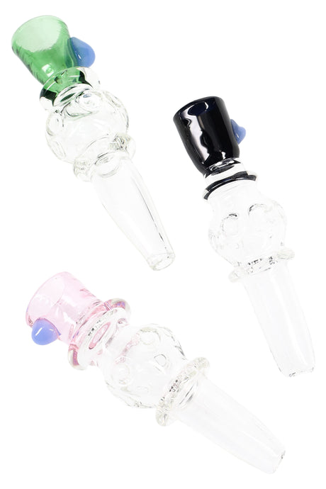 Three 4-inch thick borosilicate glass chillums with colored bowls in cobalt blue, amber, and teal, straight stems angled on white background.
