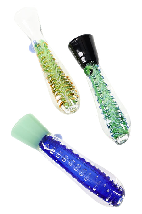 Clear 3.5-inch glass one-hitter with internal bubble-net texture and colored marble grip, resting diagonally on a white studio background.