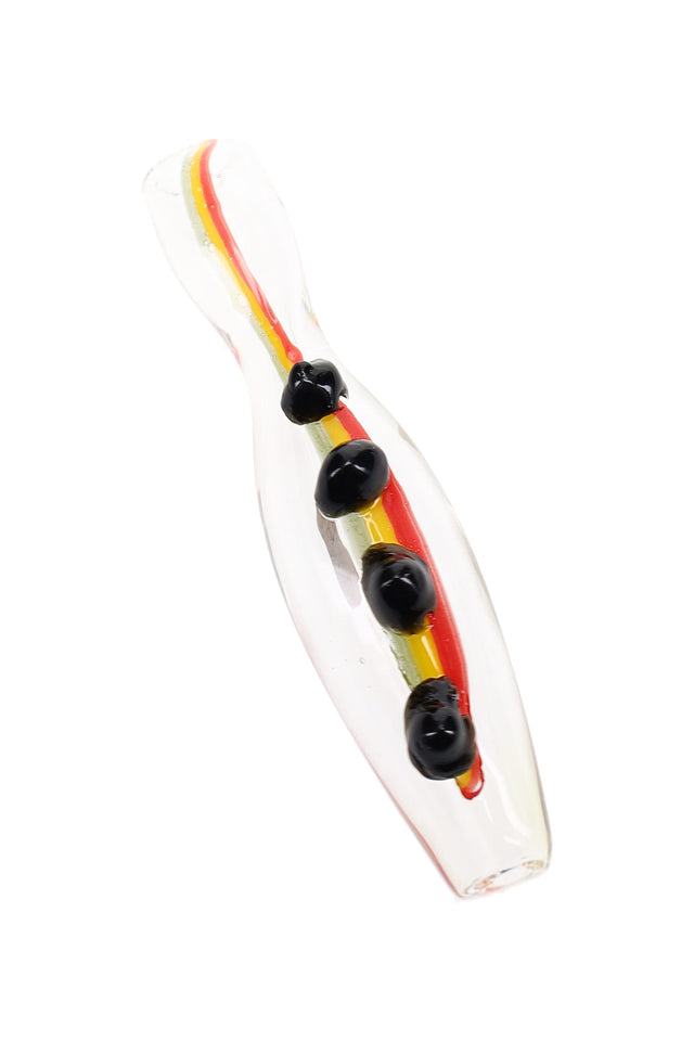 Close-up of 3″ rasta glass chillum with red, yellow, and green stripes plus colored marble grips