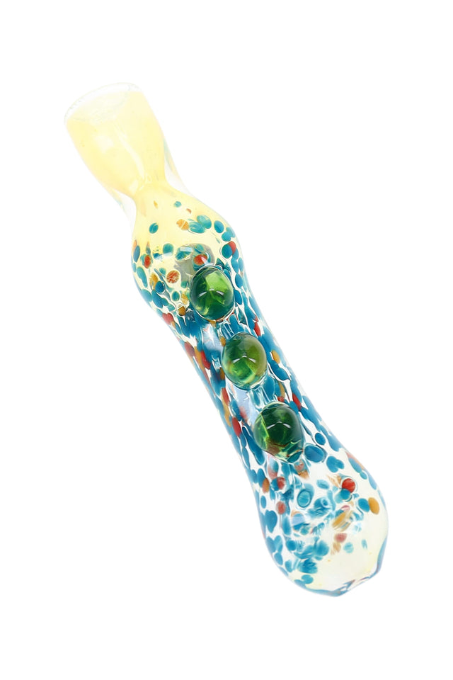 Clear 3″ glass chillum with blue, red, and amber confetti frit flecks and green marble grips