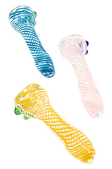 Assorted 3″ clear glass chillums with blue, pink, and yellow swirl stripes and compact one-hitter shape