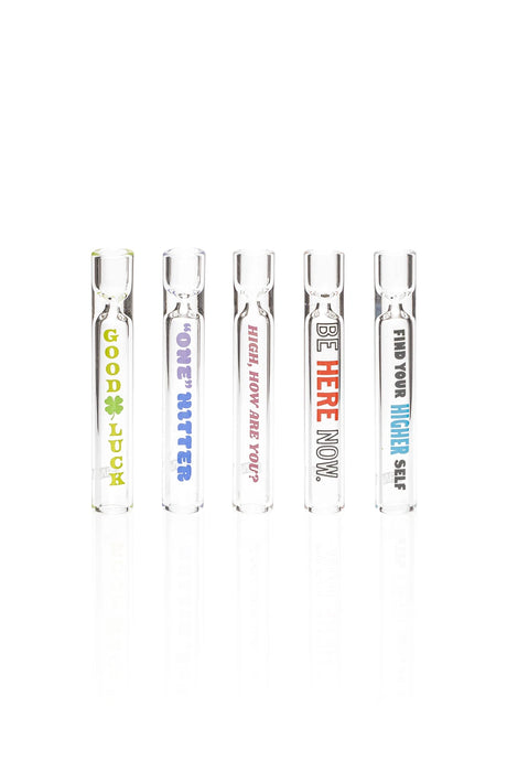 Five clear GRAV Phrases glass tasters with colorful lettering, including Good Luck and Be Here Now designs.