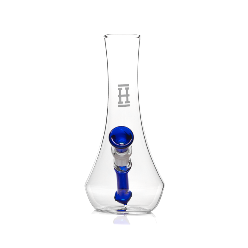 Front view of Hemper vase glass bong showing cobalt blue downstem centered in clear vase body with etched H logo, on white.