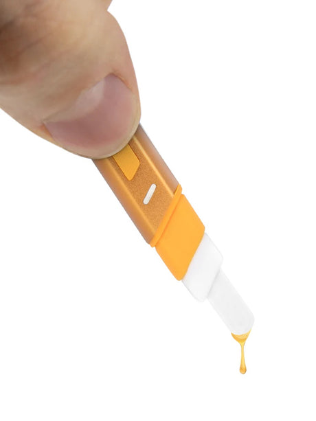 Close-up of Puffco Hot Knife dispensing concentrate as golden drop from heated ceramic tip, demonstrating mess-free loading.