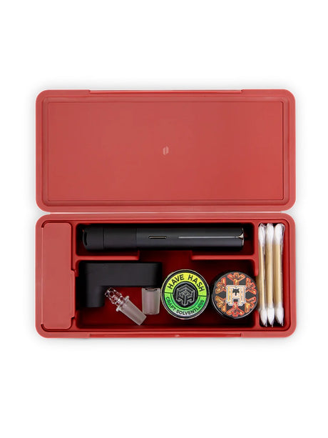 Puffco Daybreak Travel Case fully loaded with Pivot vaporizer, Hot Knife, cotton swabs and concentrate jars organized in dedicated slots.