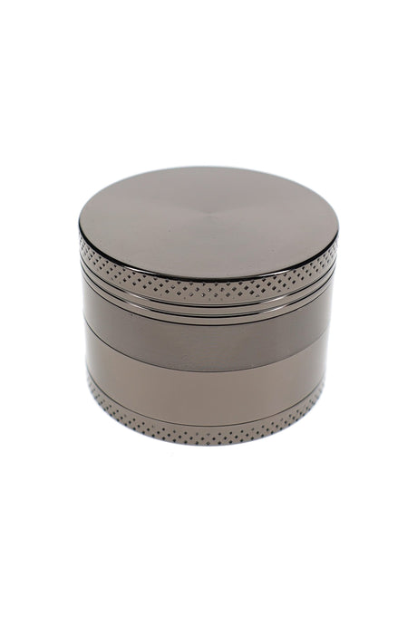 Closed silver metal herb grinder with textured grip bands and 2 inch zinc alloy body
