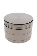 Closed silver metal herb grinder with textured grip bands and large 2.5 inch zinc alloy body