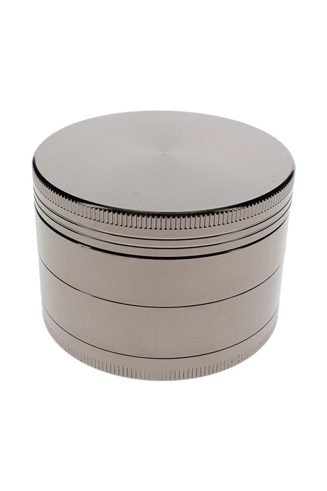 Closed silver metal herb grinder with textured grip bands and large 2.5 inch zinc alloy body
