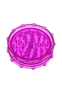 Magenta acrylic magnetic herb grinder, two-piece design with sturdy teeth and translucent body.