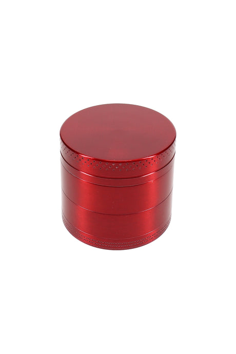 Single 1½″ 4-part metal grinder in colored finish, closed top view showing knurled edge for grip