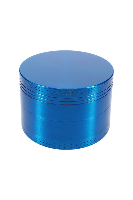 Blue 63 mm 4-part metal herb grinder with knurled edge, closed top view on white background