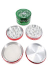 Green-top 4-part aluminum herb grinder with geometric lid engraving and red body, shown apart with grinding plates and kief screen.