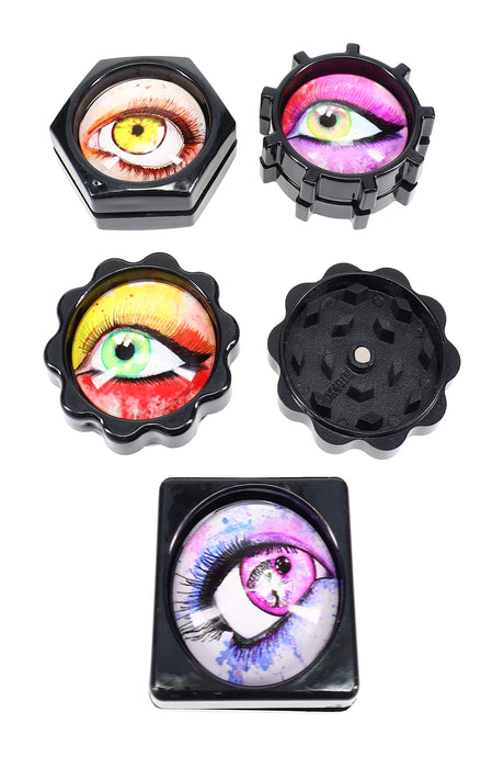Assorted eyeball mini plastic herb grinders shown disassembled, two-piece design with magnet and diamond teeth, gift set of four.