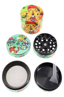 Cartoon-style wrap design zinc alloy 4-part weed grinder; disassembled with perforated plate, mesh screen, and pollen tray.