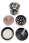 Comic-inspired print zinc alloy 4-piece herb grinder on white; lid, grinding plate, sifting screen, and base with scraper.