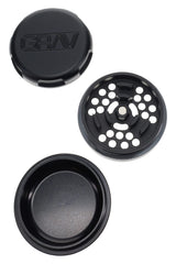 Black GRAV 3-piece grinder opened to show precision teeth plate and deep storage dish with magnetic lid.