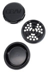 Black GRAV 3-piece grinder opened to show precision teeth plate and deep storage dish with magnetic lid.