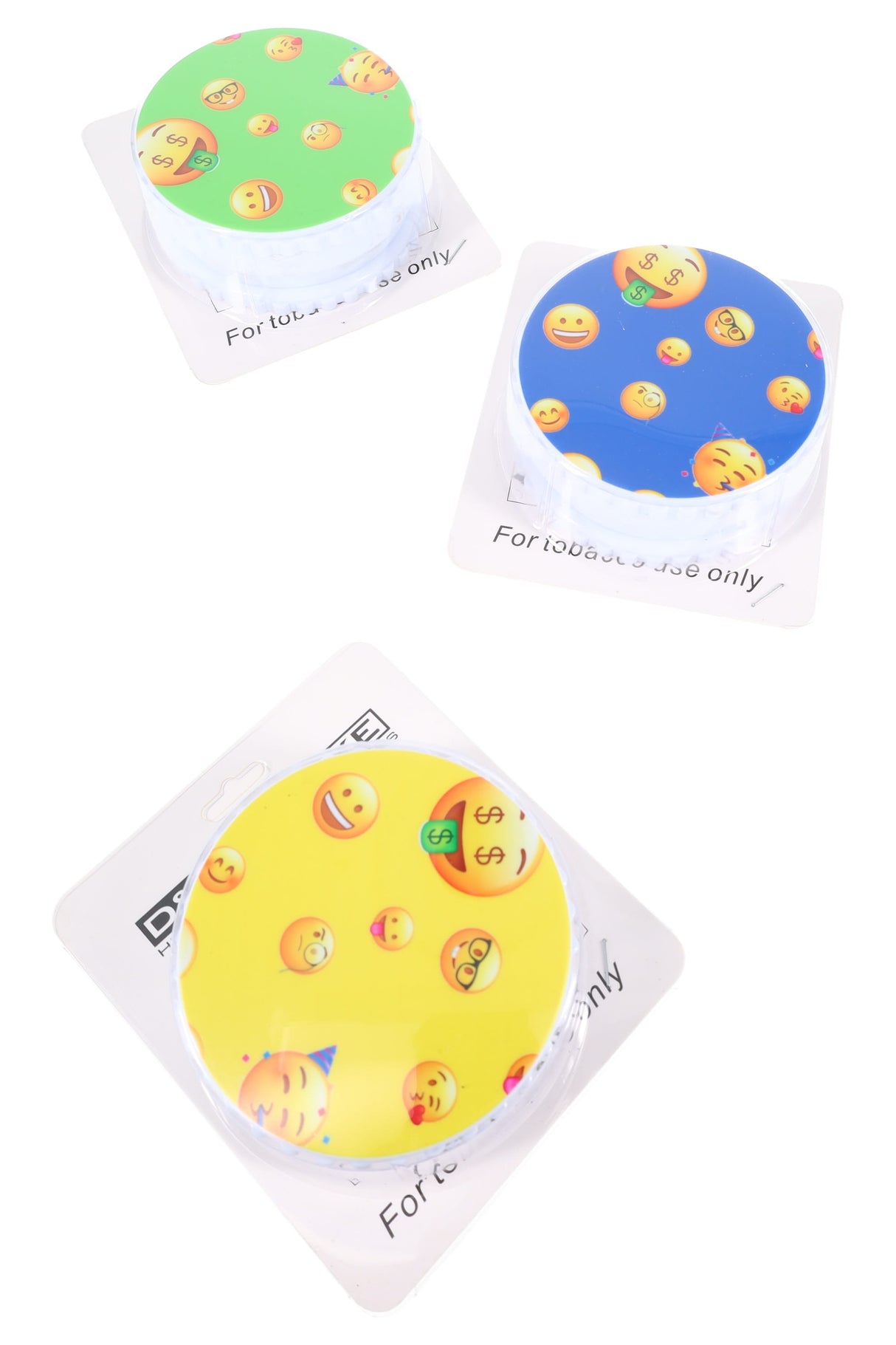 Three 4″ white plastic 3-part grinders with emoji lids in retail cards; each bundle includes a metal pipe and five silver screens.