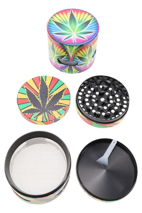 2.25-inch 4-part metal herb grinder with rainbow leaf design, side window, sifting screen and scraper tool shown disassembled