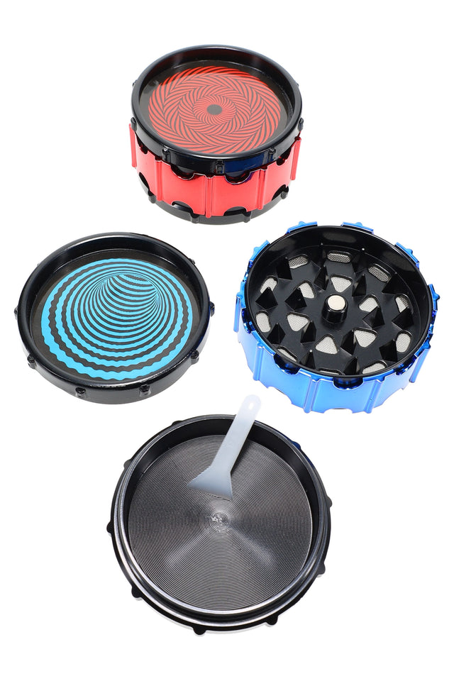 2-inch 3-part metal herb grinder with hypnotic red and blue spinner lid, mesh screen and scraper tool shown disassembled