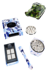 Exploded tank herb grinder pipe with blue camo shell, metal teeth, drawer, and glass bowl parts