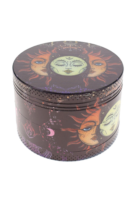 Celestial sun and moon decal metal herb grinder with dark wraparound artwork and grip texture