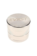 Polished EVRST metal herb grinder with engraved lid logo and textured grip bands