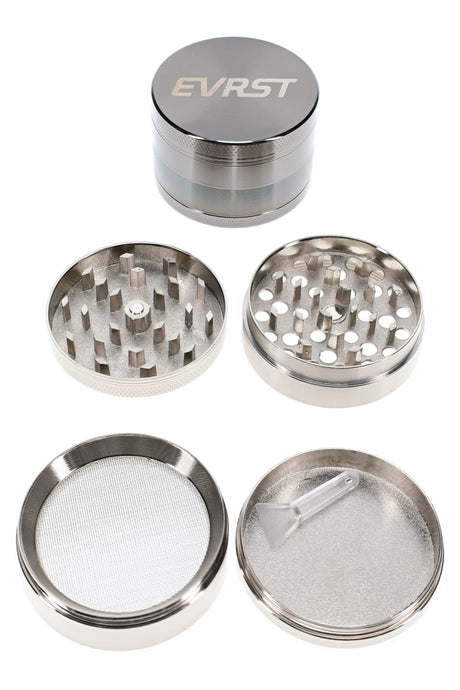 EVRST 4-part metal herb grinder in gunmetal finish with open teeth, screen, and scraper